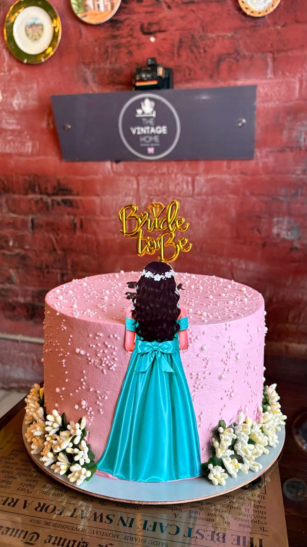 A pink bride-to-be cake made in our bakery