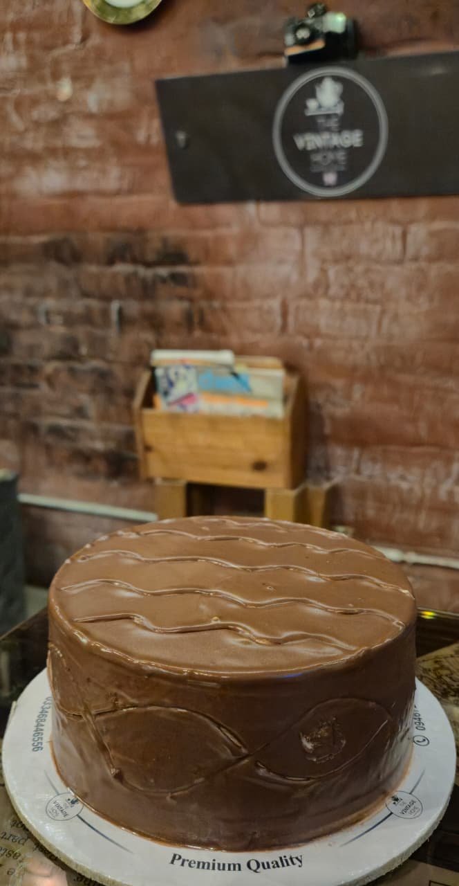 A dark chocolate fudge cake on the counter