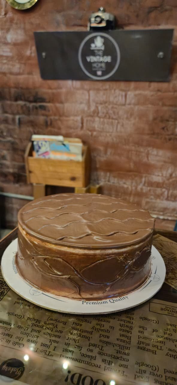 A chocolate truffle cake on the counter